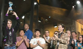 Pavel lifts the 2016 Hearthstone World Championship trophy. Kibler seems especially pleased.