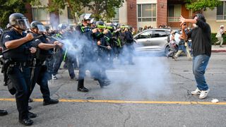  Anti-ICE protesters clash with police near the Federal Building and detention center in Los Angeles, California on June 9, 2025 amid protests over immigration raids. (Photo by Tayfun Coskun/Anadolu via Getty Images)