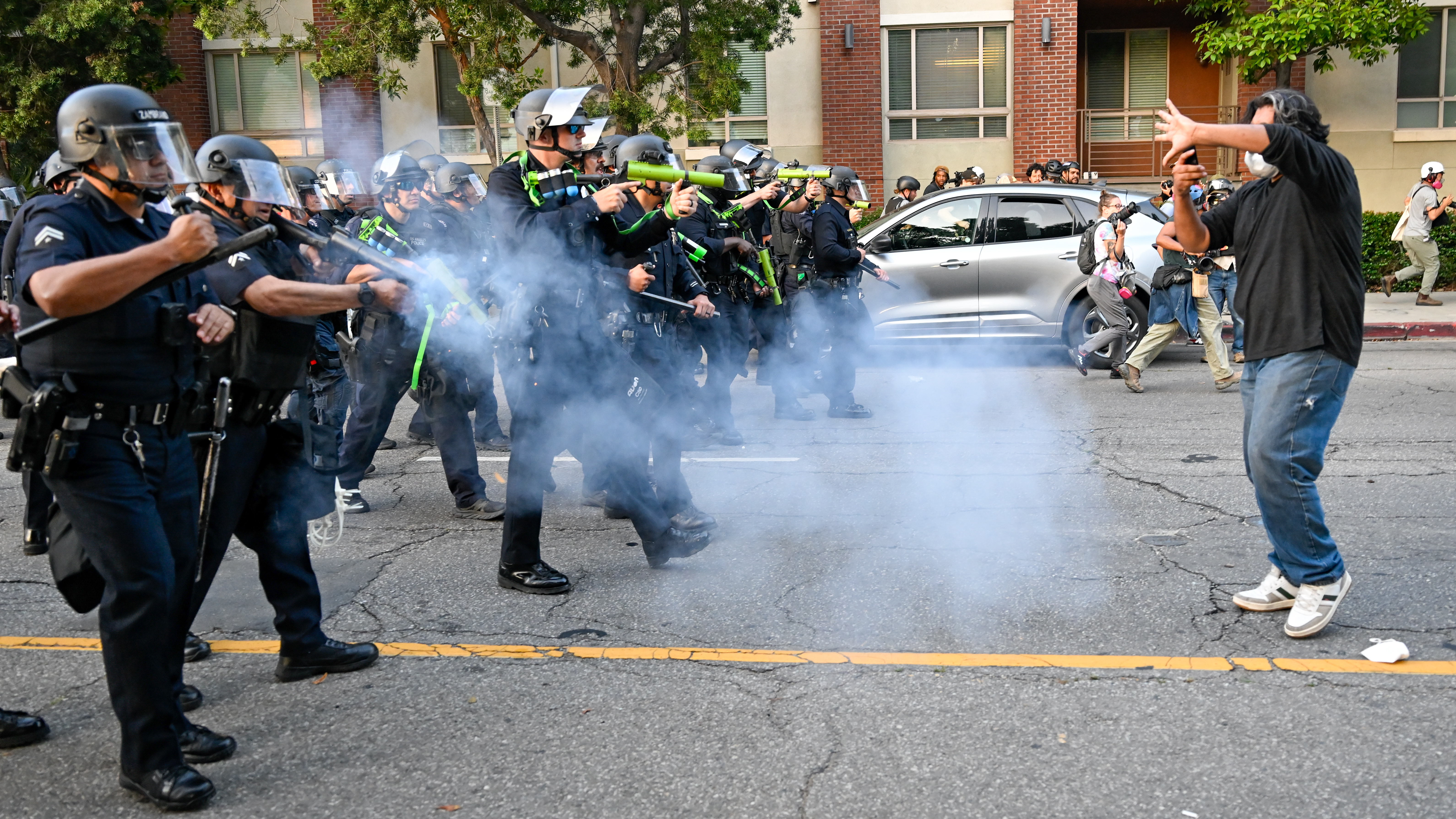 Anti-ICE protesters clash with police near the Federal Building and detention center in Los Angeles, California on June 9, 2025 amid protests over immigration raids. (Photo by Tayfun Coskun/Anadolu via Getty Images)