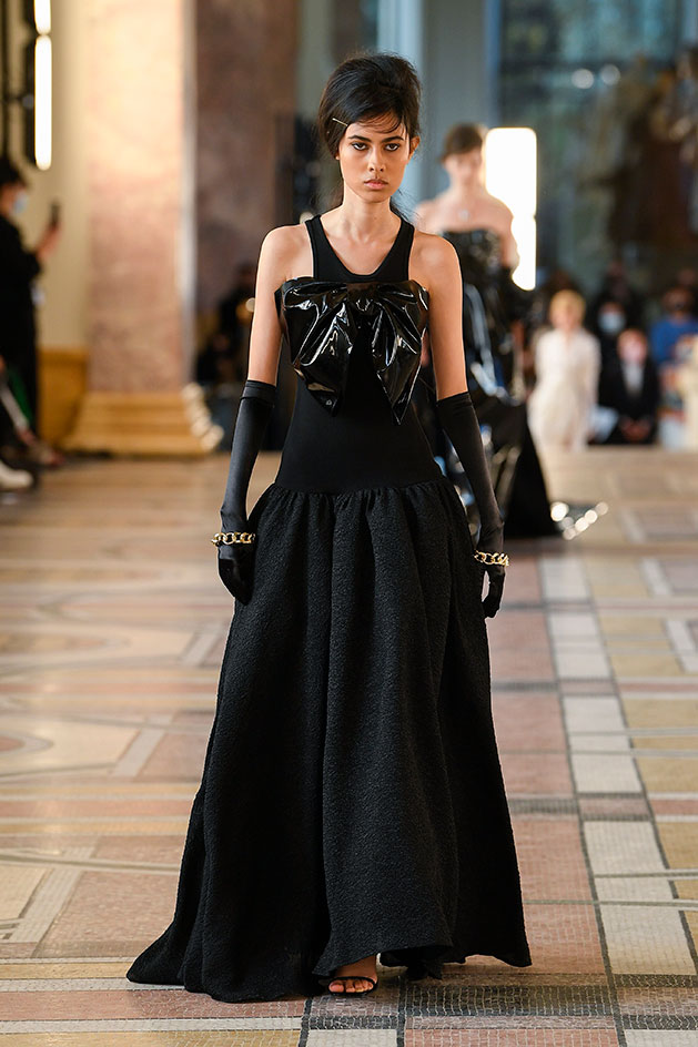 trench coats and tailoring – and present them alongside garments inspired by formal evening gowns