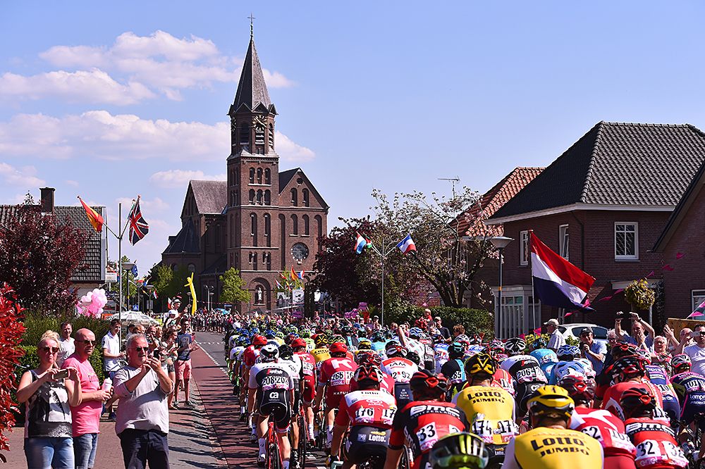 Peloton pass scenic landscape and buildings