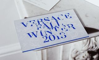 White and blue writing invite