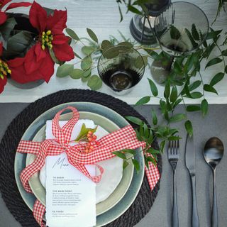 Christmas table setting with poinsettias