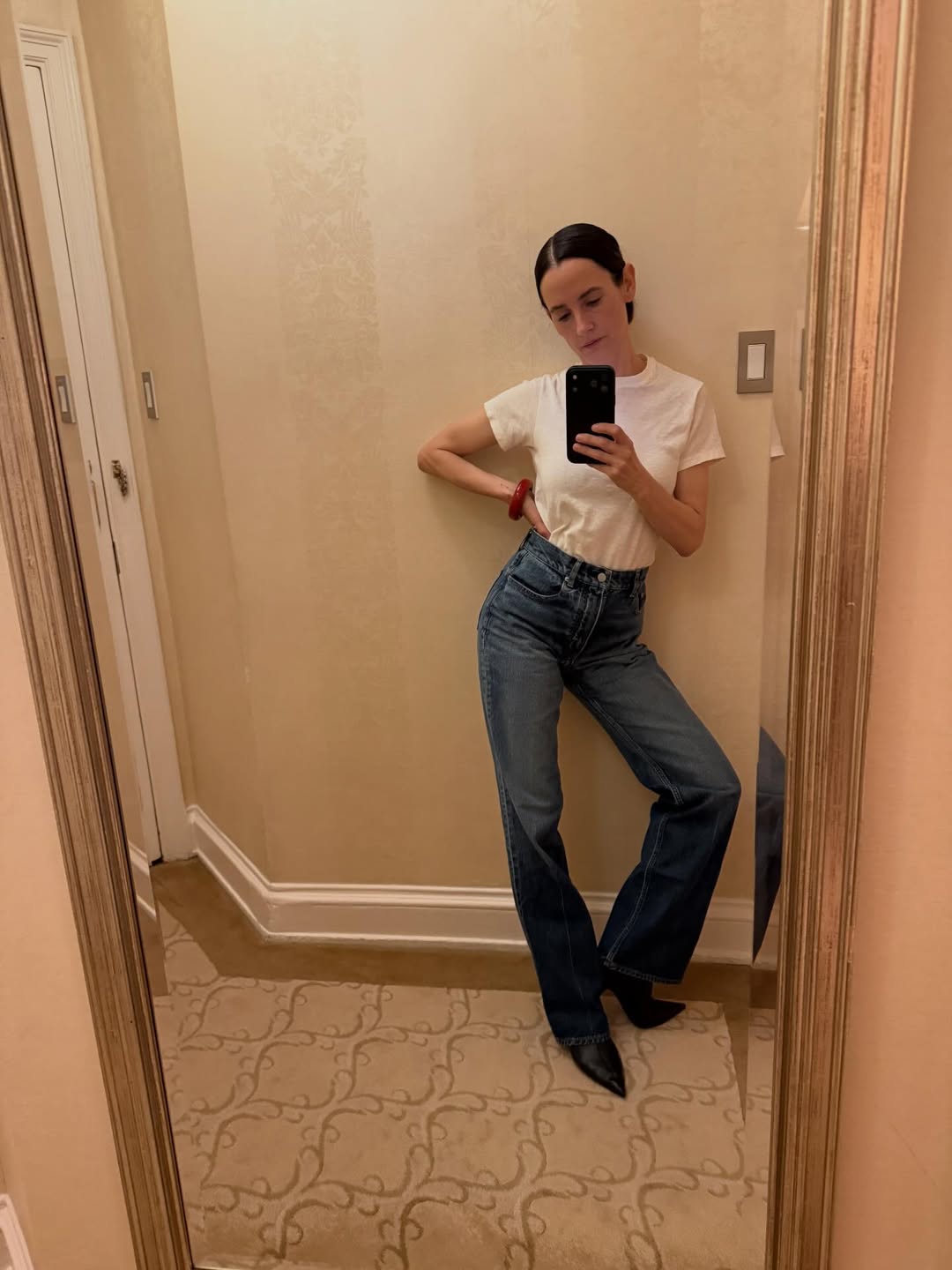 Karla Welch wearing a pair of slim-straight jeans