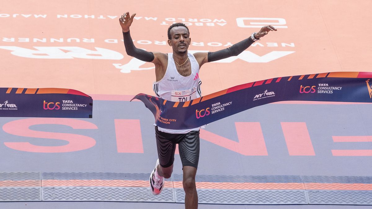 Tamirat Tola of Ethiopia crossing finish line as a winner with time 2:04:58 of TCS New York City marathon in open men&#039;s division in Central Park. Tola sets NYC Marathon course record to win men&#039;s race. 