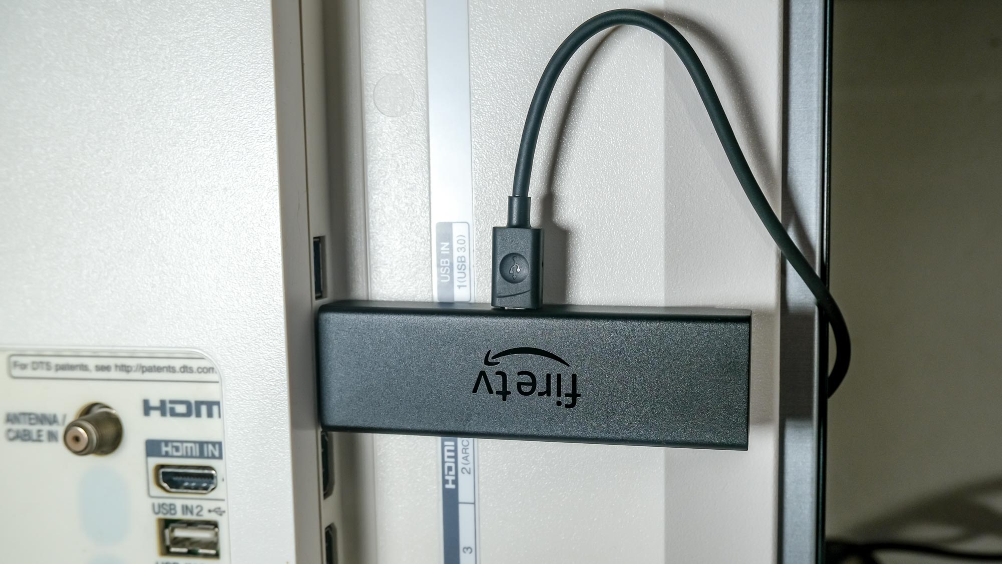 Amazon Fire TV Stick 4K Max plugged into TV