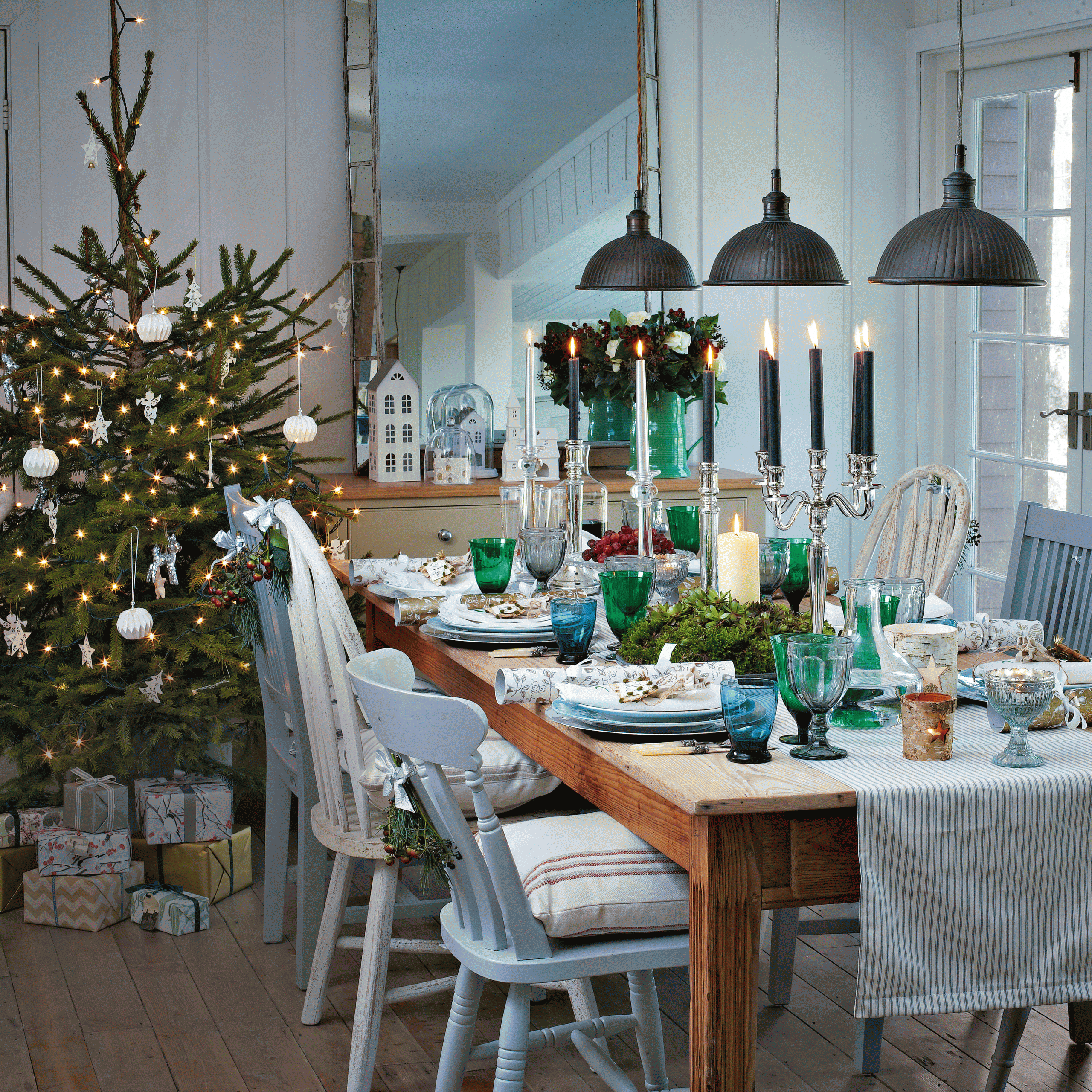 dining room with dining table and christmas tree