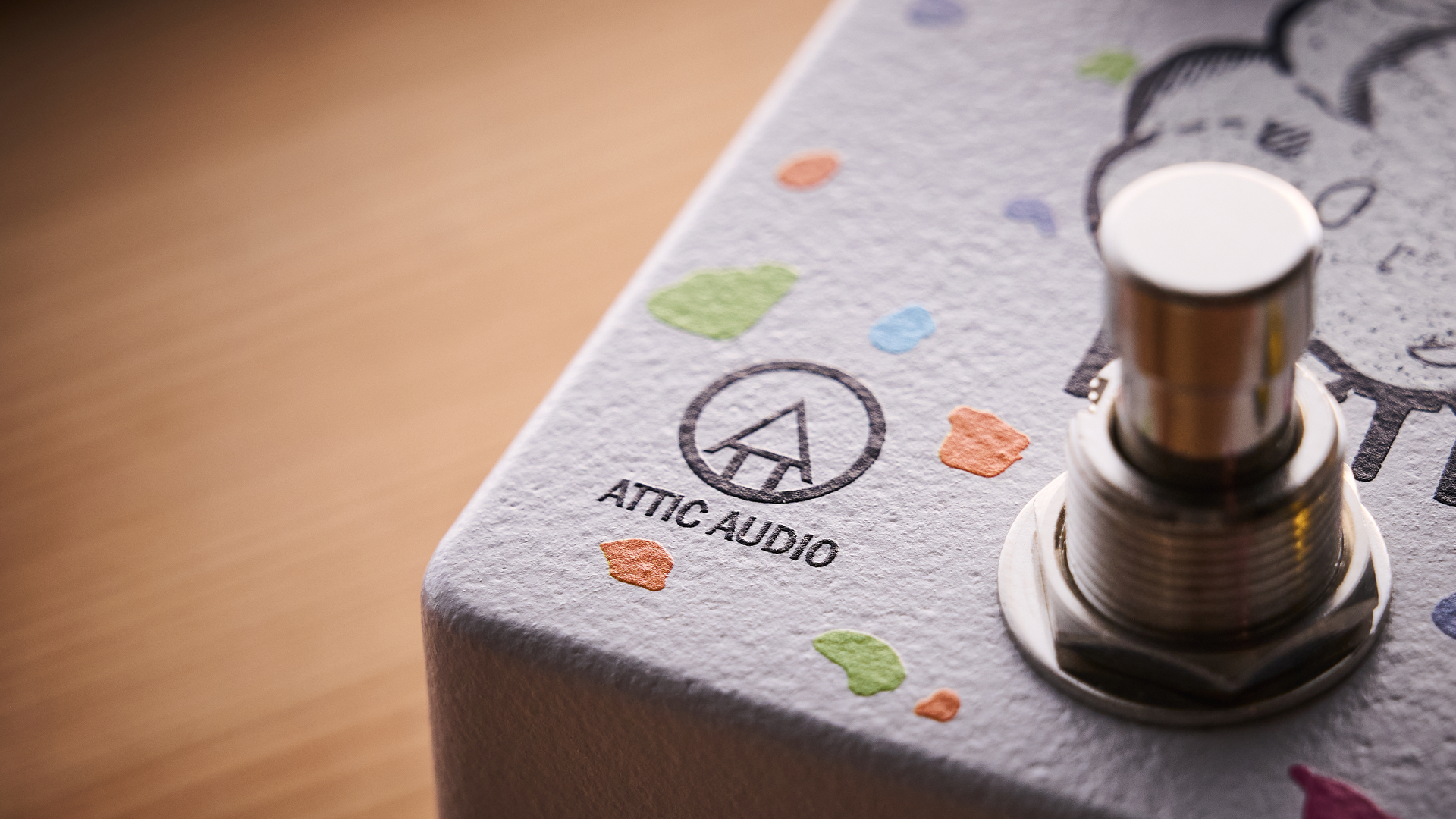 Close up of the logo on the Attic Audio Putty Saturation Preamp pedal