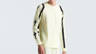 The pastel yellow long sleeve jersey with black lines on the sleeves and large Specialized S logos
