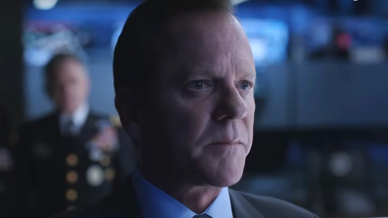 Kiefer Sutherland looks ahead with an expression of stoic upset in Designated Survivor S1.