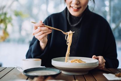 Is gluten bad for you? A woman eating pasta