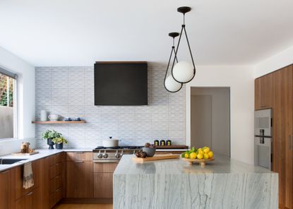 how to make a small space feel more expensive; small kitchen with marble kitchen island by Banner Day Interiors