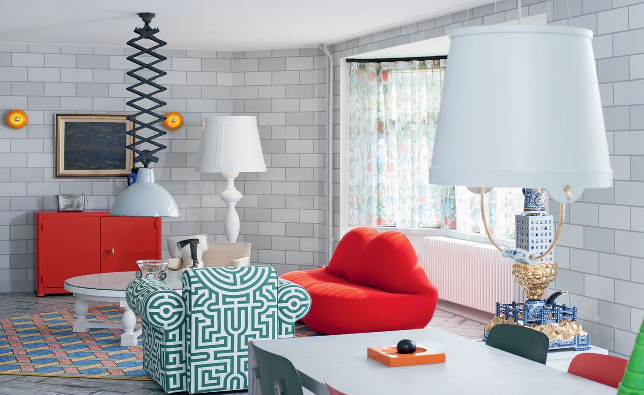 View of the inside of flat, the living features a sofa, lamps and small tables