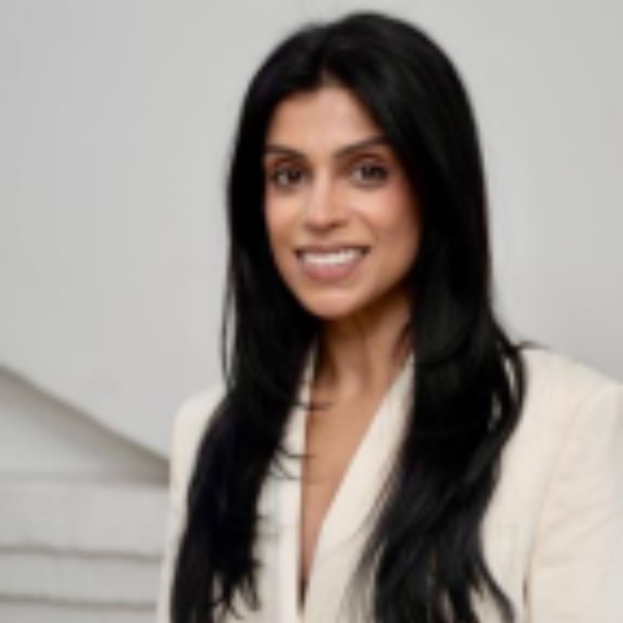 A headshot of Dr. Saema Tahir wearing a cream colored blazer.