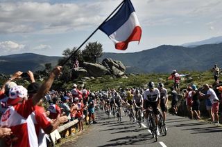 The peloton races through Massif Central during stage 14 at the Tour de France