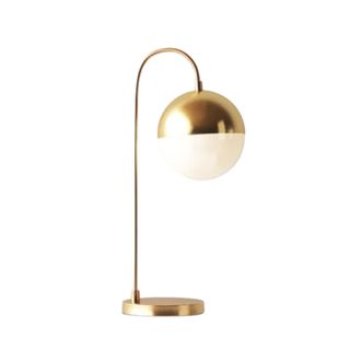 A gold lamp with a bulb