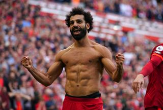 Liverpool forward Mohamed Salah celebrates shirtless