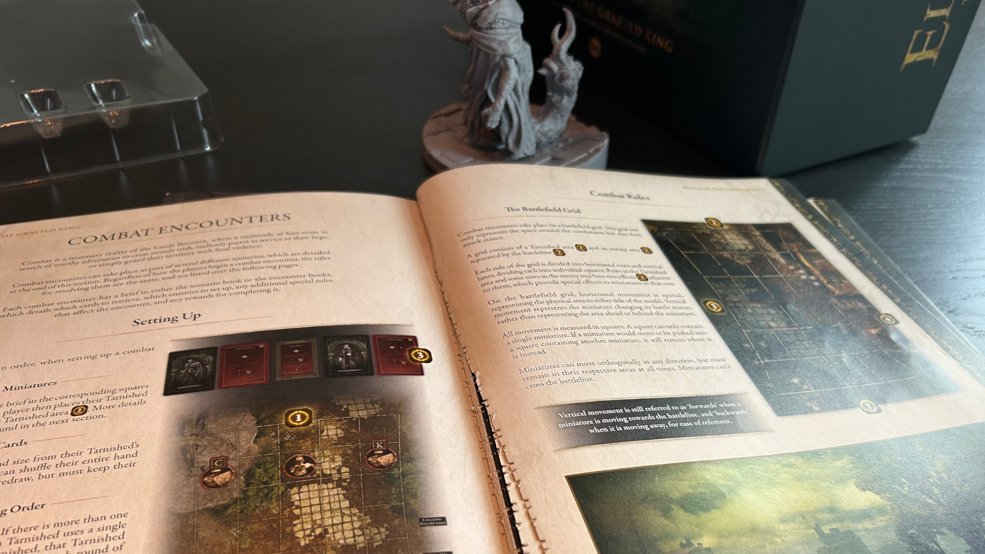 Elden Ring: The Board Game instruction booklet and miniature laid out on a wooden surface