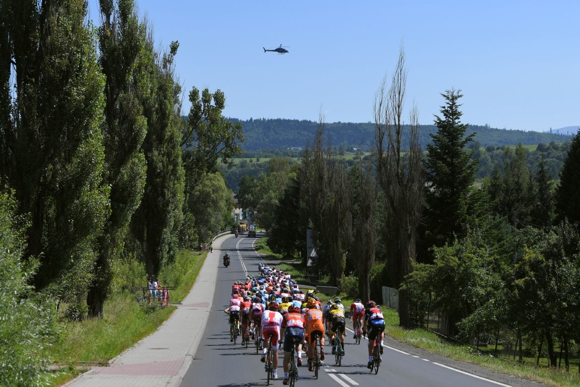 A helicopter flies overhead