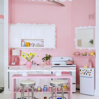 Kitchen with pink decor and kitchen island