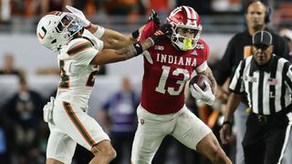 Senior Bowl hopeful Elijah Sarratt of the Indiana Hoosiers stiffarming Ethan O'Connor of the Miami Hurricanes in the 2026 CFP National Championship game