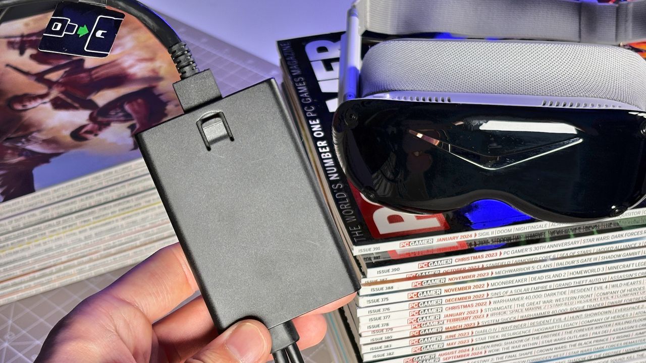 The Pimax Dream Air in white on a stack of PC Gamer magazine.