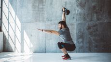Man exercising with a kettlebell