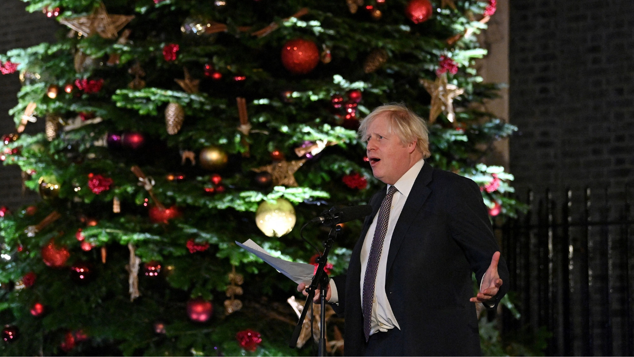 Boris Johnson in front of a Christmas tree