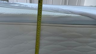 Measuring the height of the bed that the Tempur Cooling Tencel is fitted on