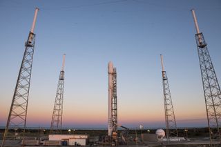 The SpaceX Falcon 9 rocket carrying the SES-9 communications satellite stands poised for its fourth launch attempt in two weeks at Florida's Cape Canaveral Air Force Station. The rocket is slated to launch Friday, March 4, at 6:35 p.m. ET, then try to lan
