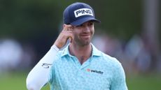 Alex Smalley acknowledges the crowd on the 18th during the third round of the 2026 PGA Championship at Aronimink Golf Club