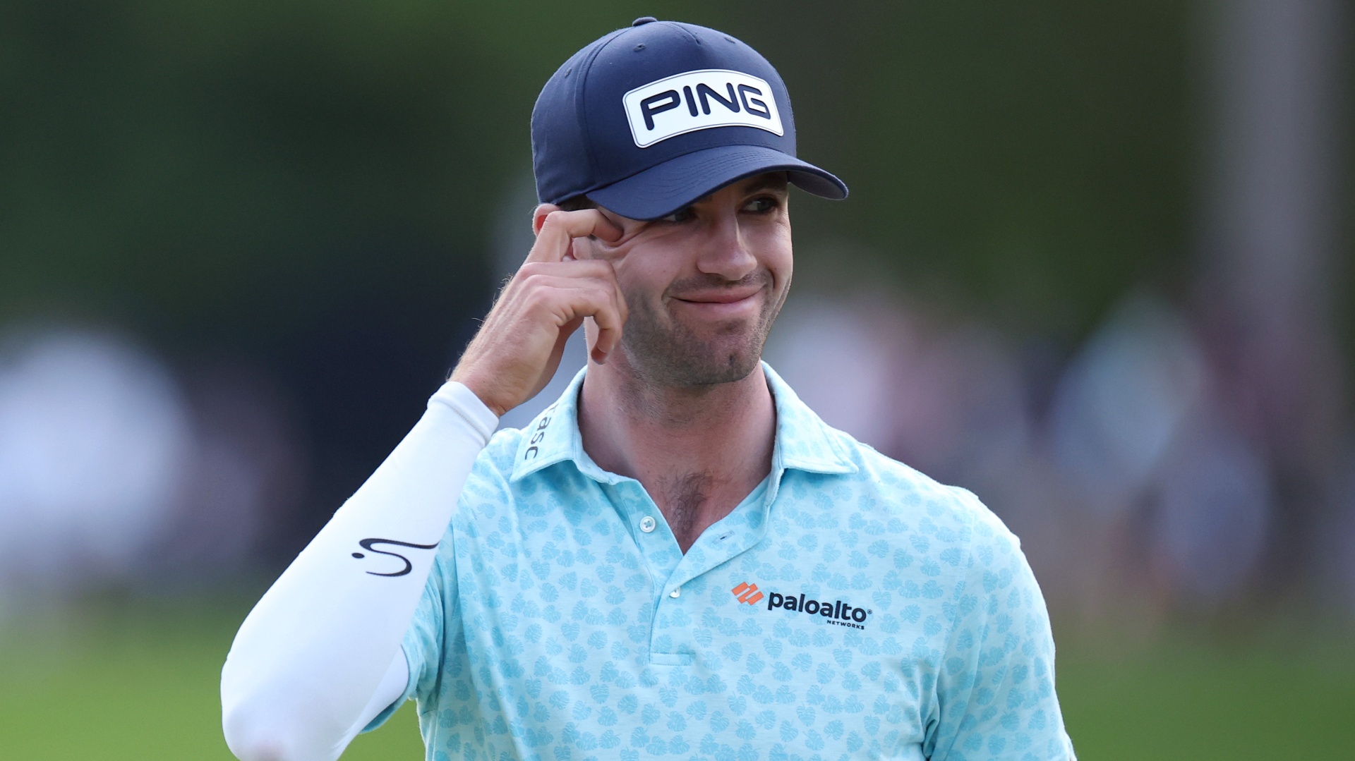 Alex Smalley acknowledges the crowd on the 18th during the third round of the 2026 PGA Championship at Aronimink Golf Club