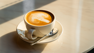 Mug of coffee on table