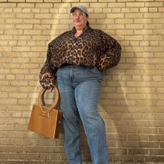 Sarah Chiwaya wearing a leopard print bomber and straight leg jeans