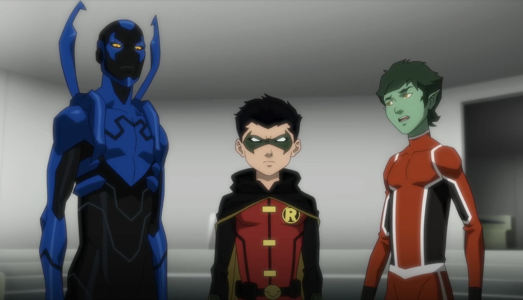 Blue Beetle, Robin and Beast Boy look ahead in Teen Titans vs. Justice League
