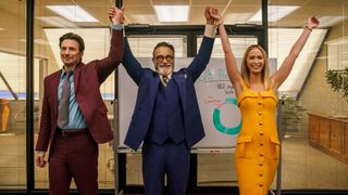Neil holds his, Brenner's, and Liza's arms aloft in Pain Hustlers on Netflix