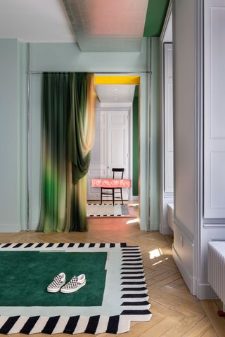 an apartment with a curtain separating an open doorway