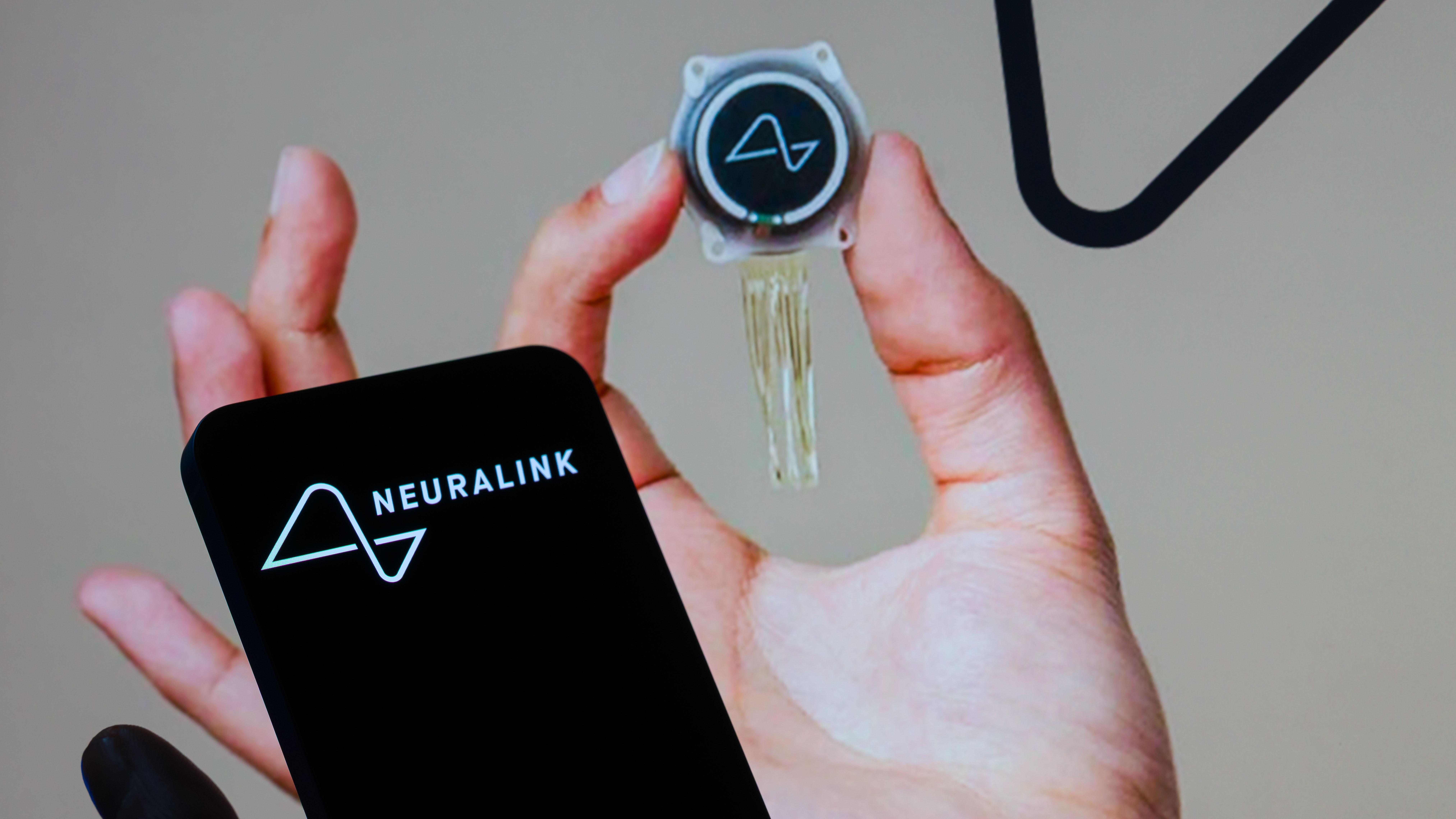 Neuralink logo and chip.