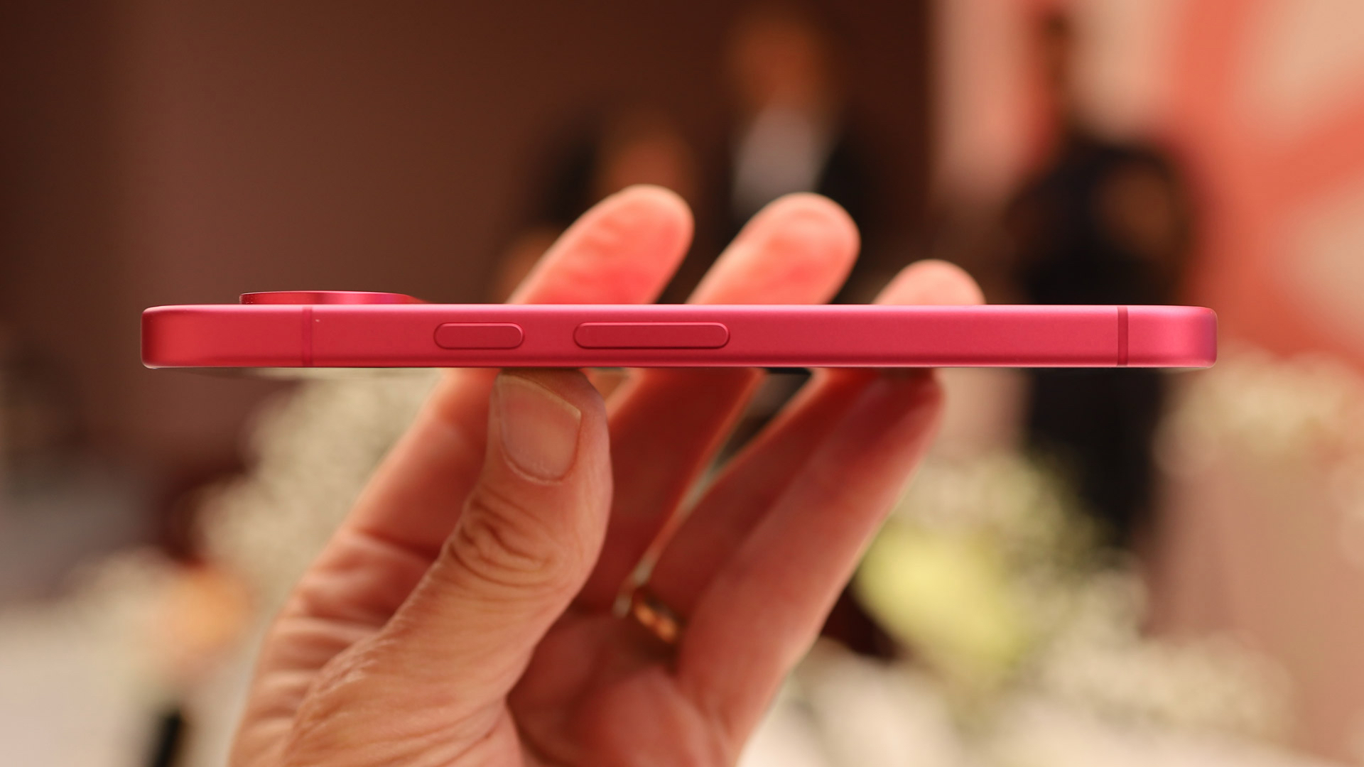Google Pixel 11 Hands On showing the reduced thickness when held in a man's hand
