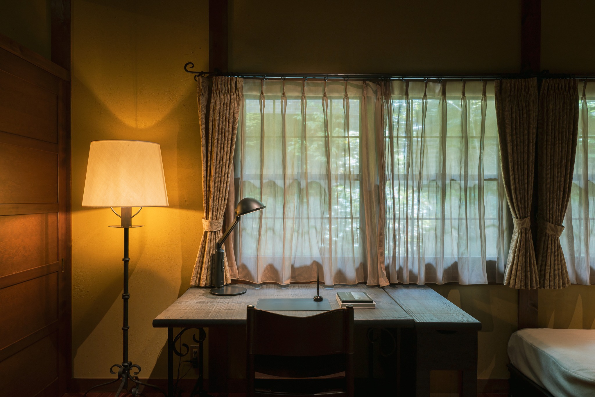 A luxury Japanese hotel boasting warmly lit interiors and traditional decor while being totally immersed in nature.