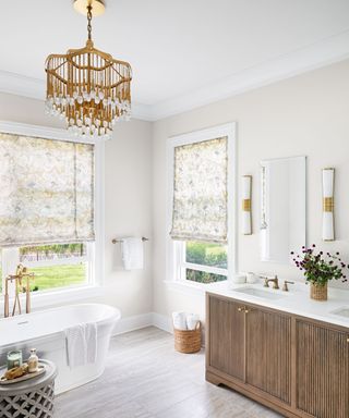 bathroom with white walls and reeded wooden anity and boat bath