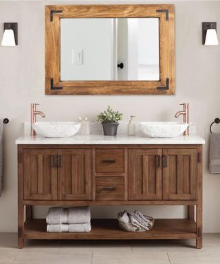 Wooden bathroom with a wooden vanity and wood framed bathroom mirror