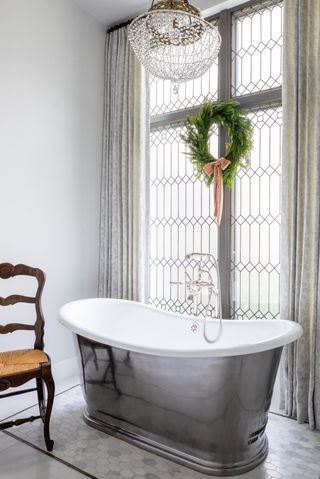 Bathroom chandelier with Christmas wreath by Marie Flanigan