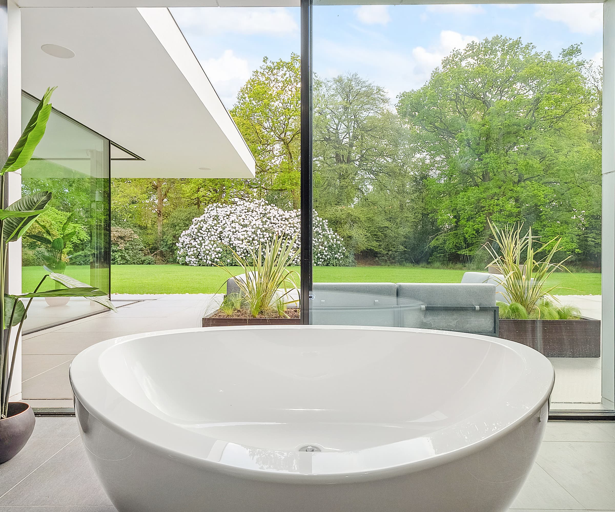 A bath next to a bifold door