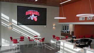 A MAXHUB Raptor series display provides info to a Bakersfield College student room.