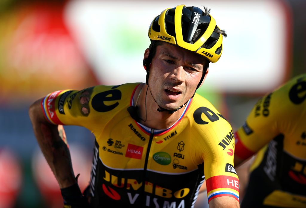 TOMARES SPAIN SEPTEMBER 06 Primoz Roglic of Slovenia crosses the finish line injured after being involved in a crash in the final sprint during the 77th Tour of Spain 2022 Stage 16 a 1894km stage from Sanlcar de Barrameda to Tomares LaVuelta22 WorldTour on September 06 2022 in Tomares Spain Photo by Justin SetterfieldGetty Images