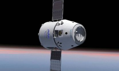 This computer generated image provided by SpaceX shows their Dragon spacecraft with solar panels deployed. 