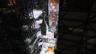 The Orion spacecraft that will fly uncrewed to the moon in a few months is being attached to the Space Launch System rocket at the iconic Vehicle Assembly Building at NASA's Kennedy Space Center in Florida.