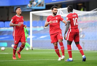 Liverpool forwards Roberto Firmino, Mohamed Salah and Sadio Mane celebrate a goal