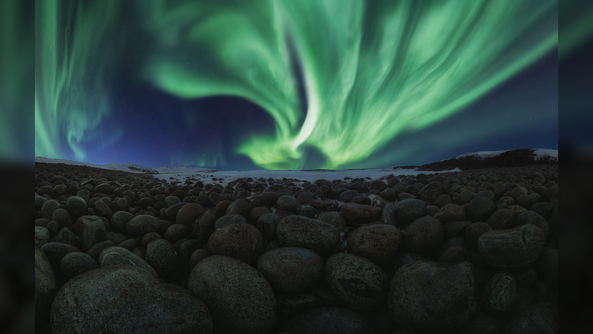 A photo of the northern lights, part of the travel photography blog Capture the Atlas 2022 Northern Lights Photographer of the Year collection. This image was taken by Jose D. Riquelme.